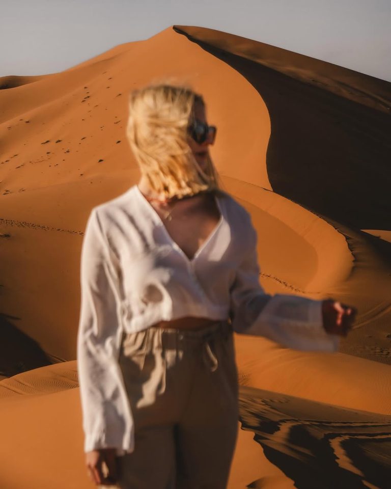 Guided Walking Tour Woman exploring the sand dunes of Merzouga – Merzouga