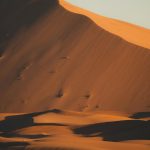 Tall orange sand dune in the Sahara near Merzouga – Merzouga, Morocco
