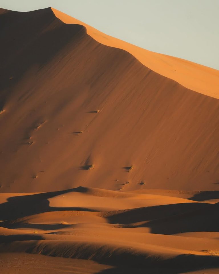 Tall orange sand dune in the Sahara near Merzouga – Merzouga