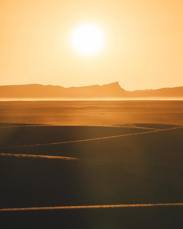 Sun over the desert horizon in Merzouga – Merzouga