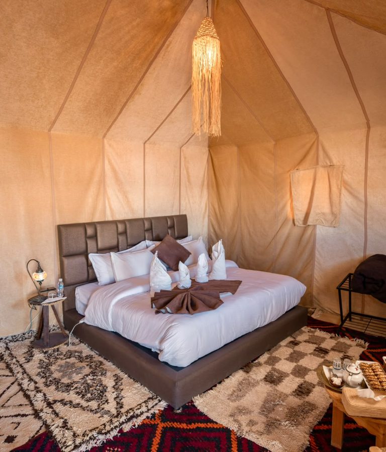 Luxury desert camp tent bedroom with a double bed – Merzouga
