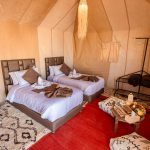 Luxury suite tent with king bed and Berber rugs – Merzouga, Morocco