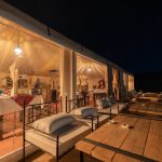 Restaurant tent and lounge terrace of a desert camp at night – Merzouga, Morocco