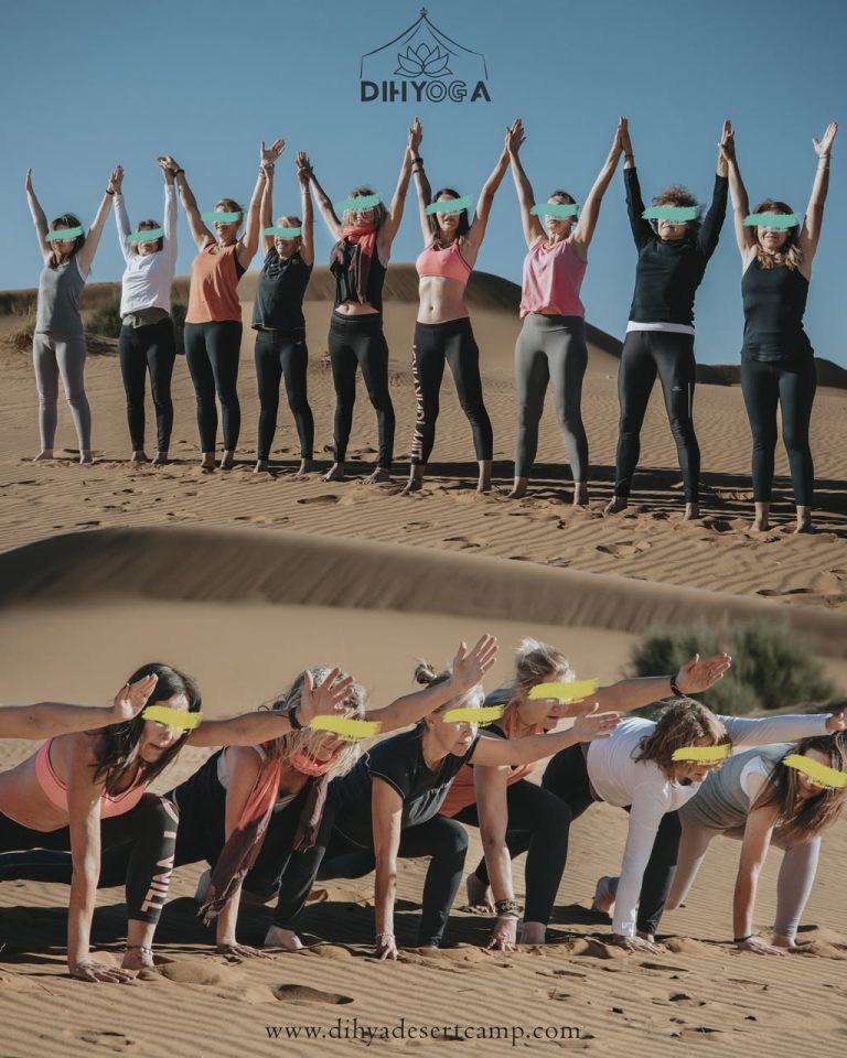 Yoga Retreat in the Sahara Yoga group raising their arms in the desert – Merzouga