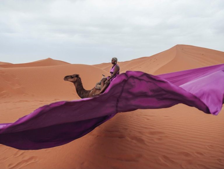 Yoga Retreat in the Sahara Purple scarf flying in the wind on a Sahara dune – Merzouga