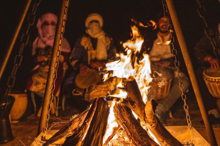 Campfire with Berber drummers under the night sky – Merzouga