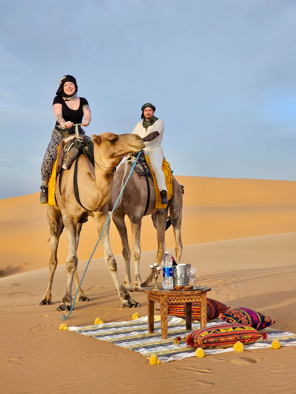 Camel Ride Travellers riding camels to a tea setup in the dunes – Merzouga