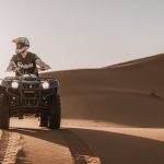Rider on an ATV quad bike in the dunes – Merzouga, Morocco