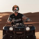 Rider in a helmet on an ATV quad bike in the Sahara – Merzouga, Morocco