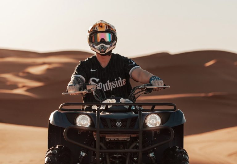 ATV Quad Bike Rider in a helmet on an ATV quad bike in the Sahara – Merzouga