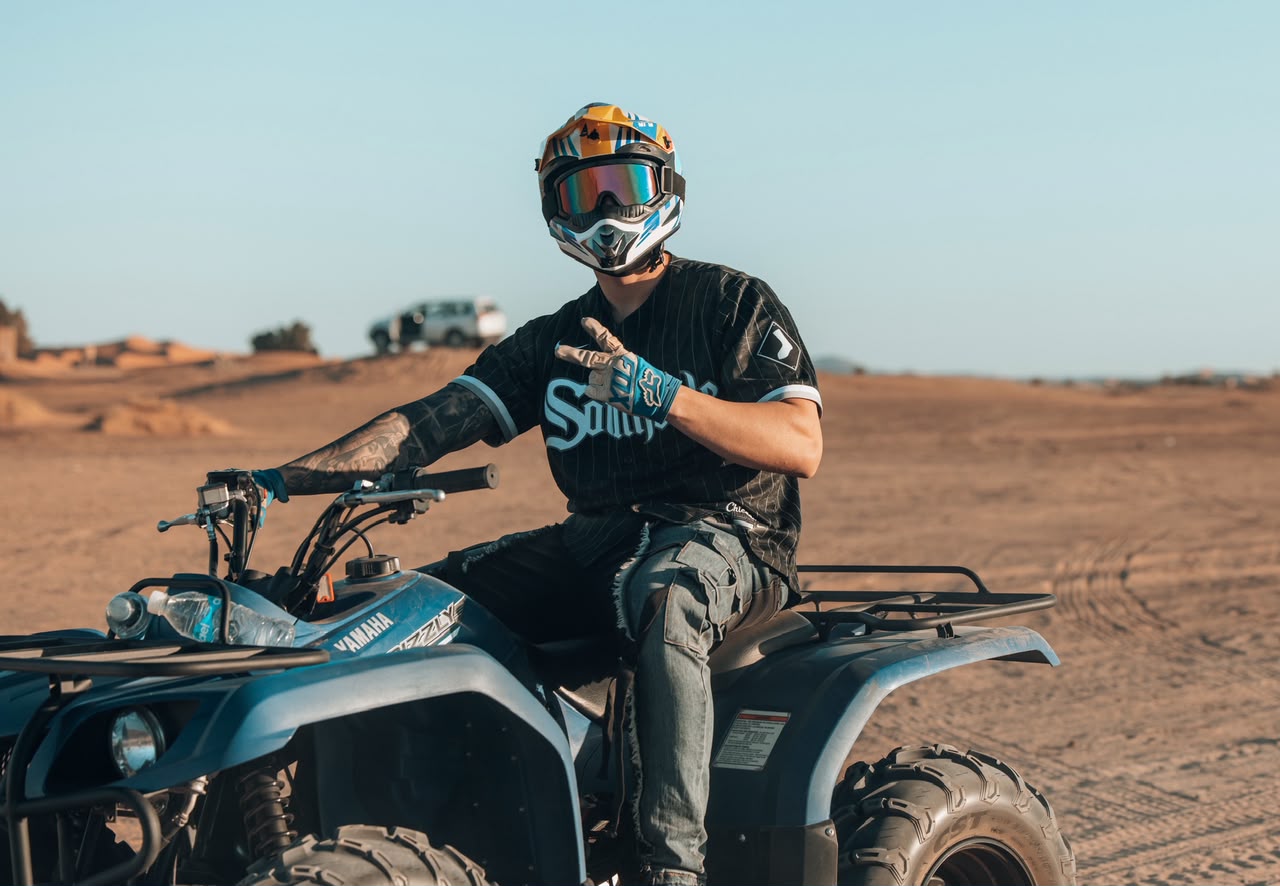 Camel Ride Smiling rider on a quad bike in the Merzouga desert – Merzouga