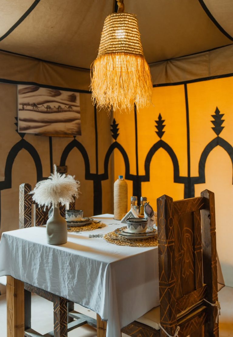 Dining table set for dinner in a desert camp restaurant – Merzouga