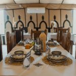 Dinner tables in a desert camp restaurant – Merzouga, Morocco