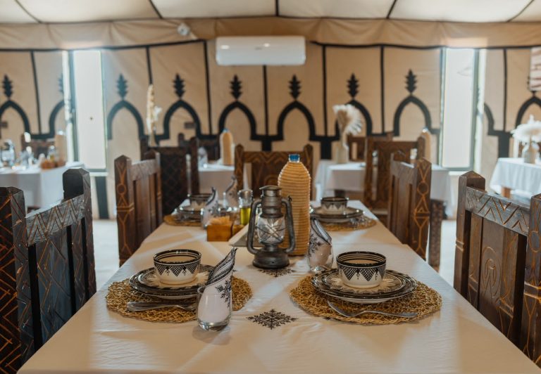 Dinner tables in a desert camp restaurant – Merzouga