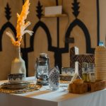 Table set for dinner with Moroccan pottery – Merzouga, Morocco